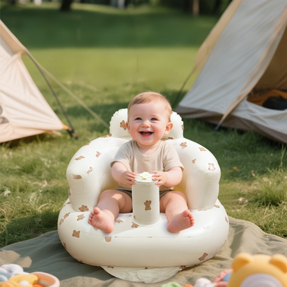 Baby giggles in the ComfyBub™ portable and foldable inflatable baby seat at a campsite - enjoying outdoor play