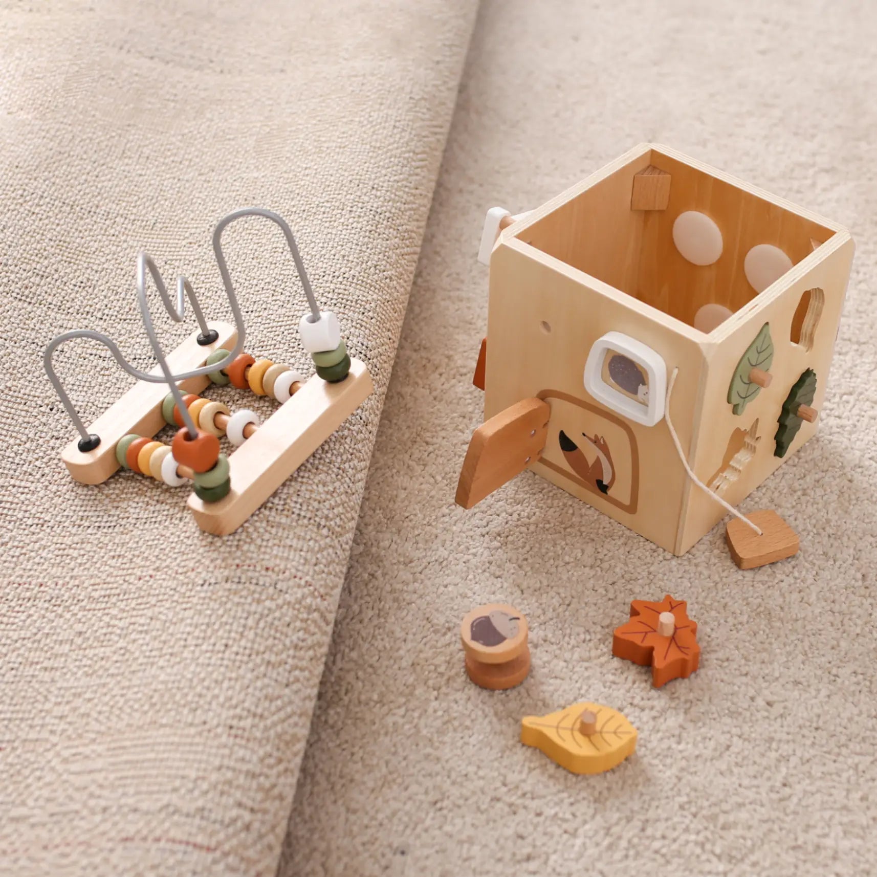 Portable 5-in-1 wooden activity cube for travel and home play – all toy pieces shown separately